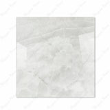 Onyx Lural glossy porcelain tile 120x120cm displayed on easel against luxury marble backdrop for UAE interior design