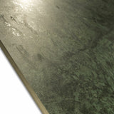 Close-up of Bidasar Excel glossy porcelain slab showing reflective polished green surface, textured detail, and 9mm rectified edge thickness