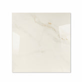 Cecelia Gold glossy porcelain tile 120x120cm displayed on easel against luxury marble backdrop for UAE interior design