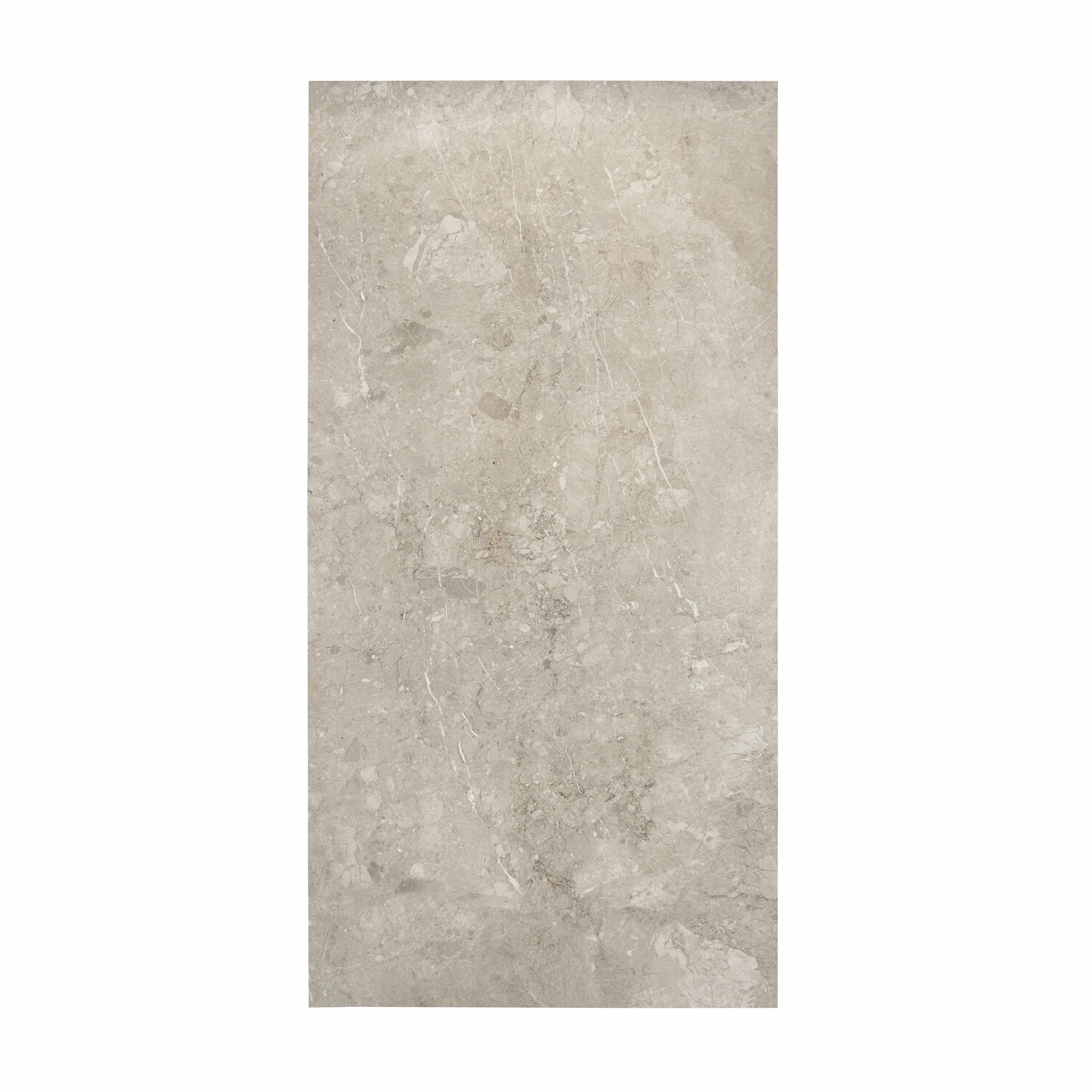 Element Coach Smoke porcelain slab displayed on easel against luxury backdrop showing smoky grey natural stone surface with terrazzo-like texture for UAE interior design