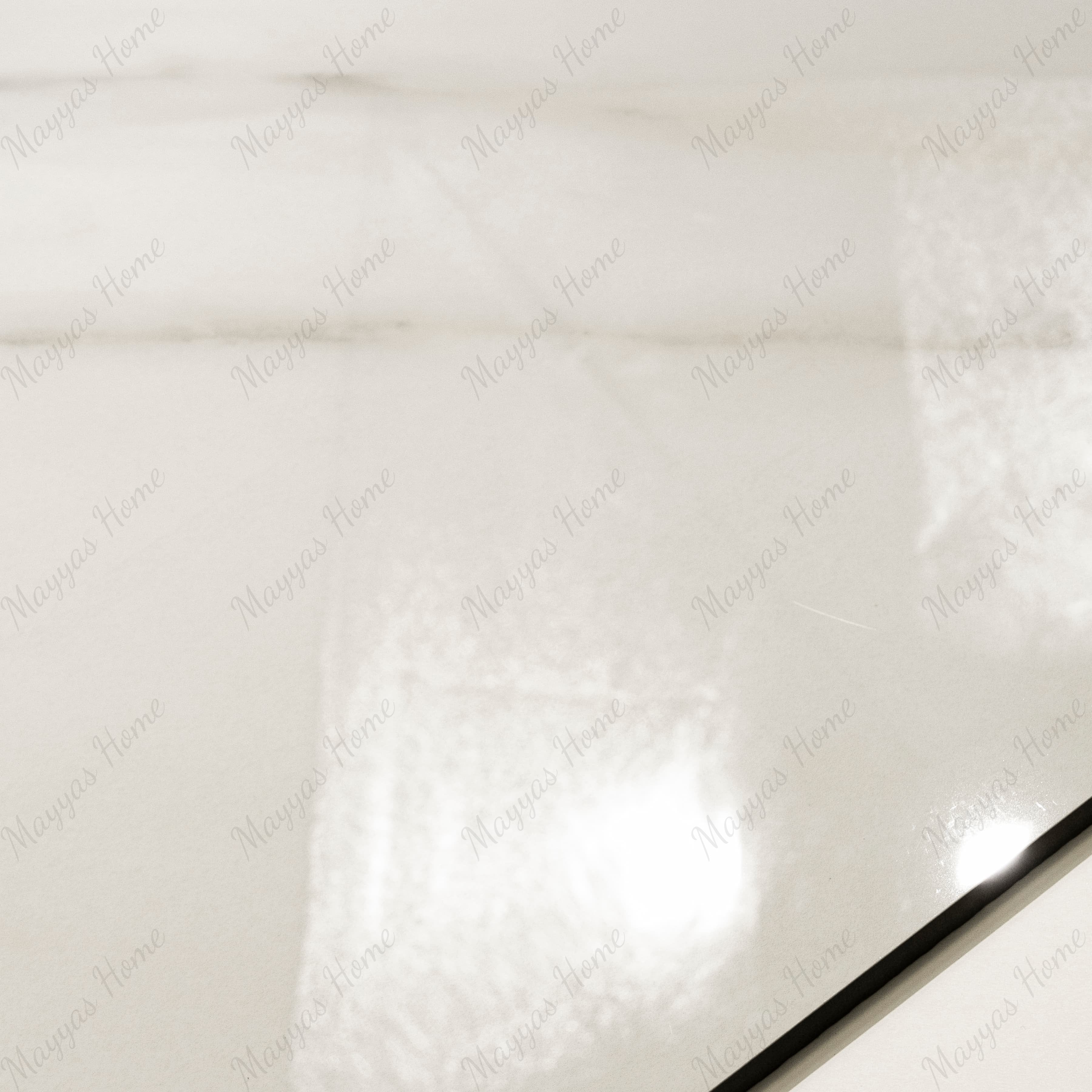 Close-up of Calcutta Aurora glossy porcelain tile showing mirror-polished white marble surface with detailed grey vein clusters and 9mm thickness