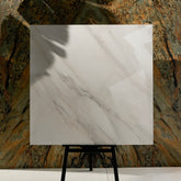 Calcutta Aurora 120x120cm glossy porcelain tile flat view showing bright white Calacatta marble surface with flowing grey veining
