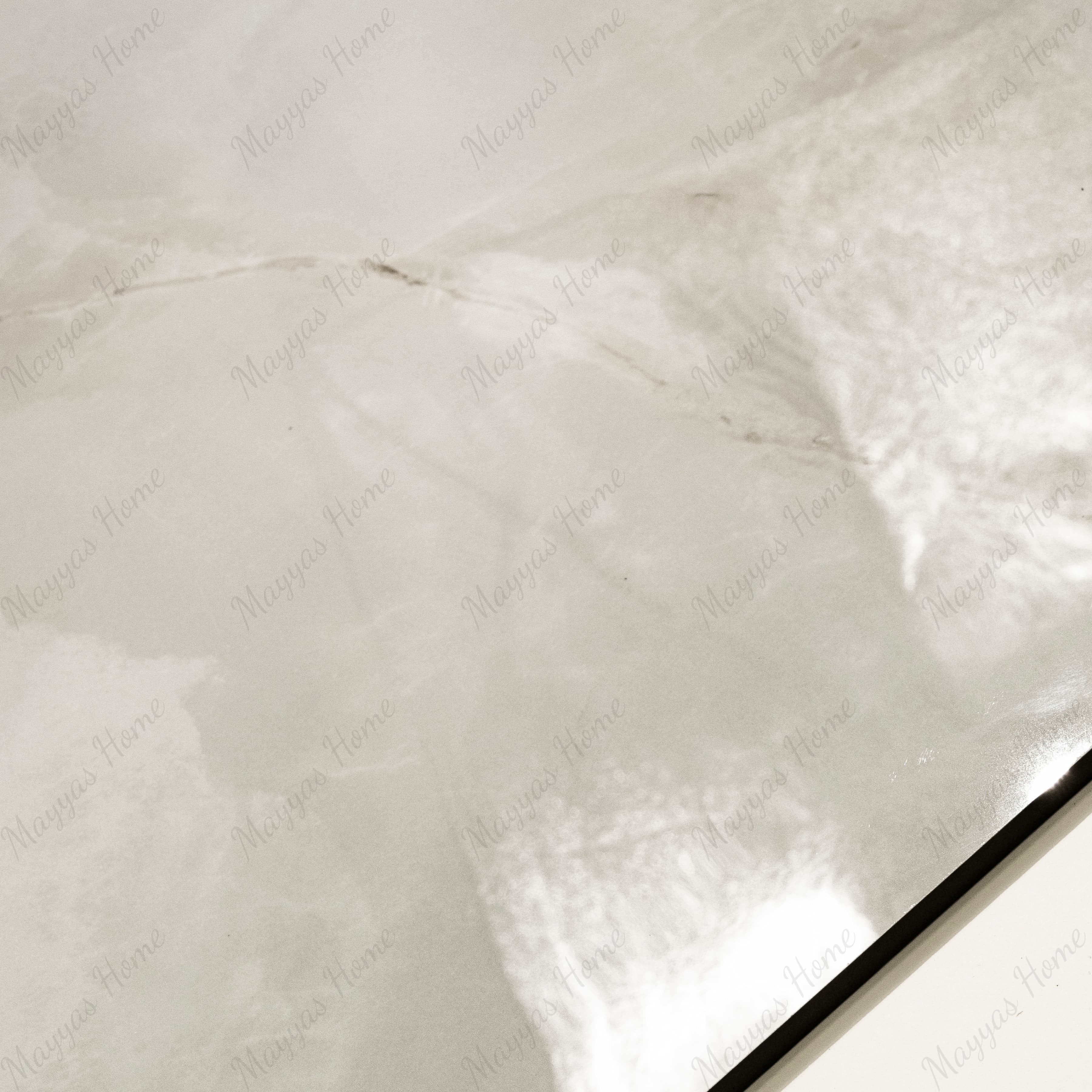 Close-up of Marbella Gold glossy porcelain tile showing mirror-polished cream onyx surface with detailed gold vein detail and 9mm thickness