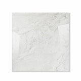 Silver Fume glossy porcelain tile 120x120cm displayed on easel against luxury marble backdrop for UAE interior design