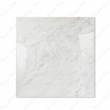 Silver Fume glossy porcelain tile 120x120cm displayed on easel against luxury marble backdrop for UAE interior design