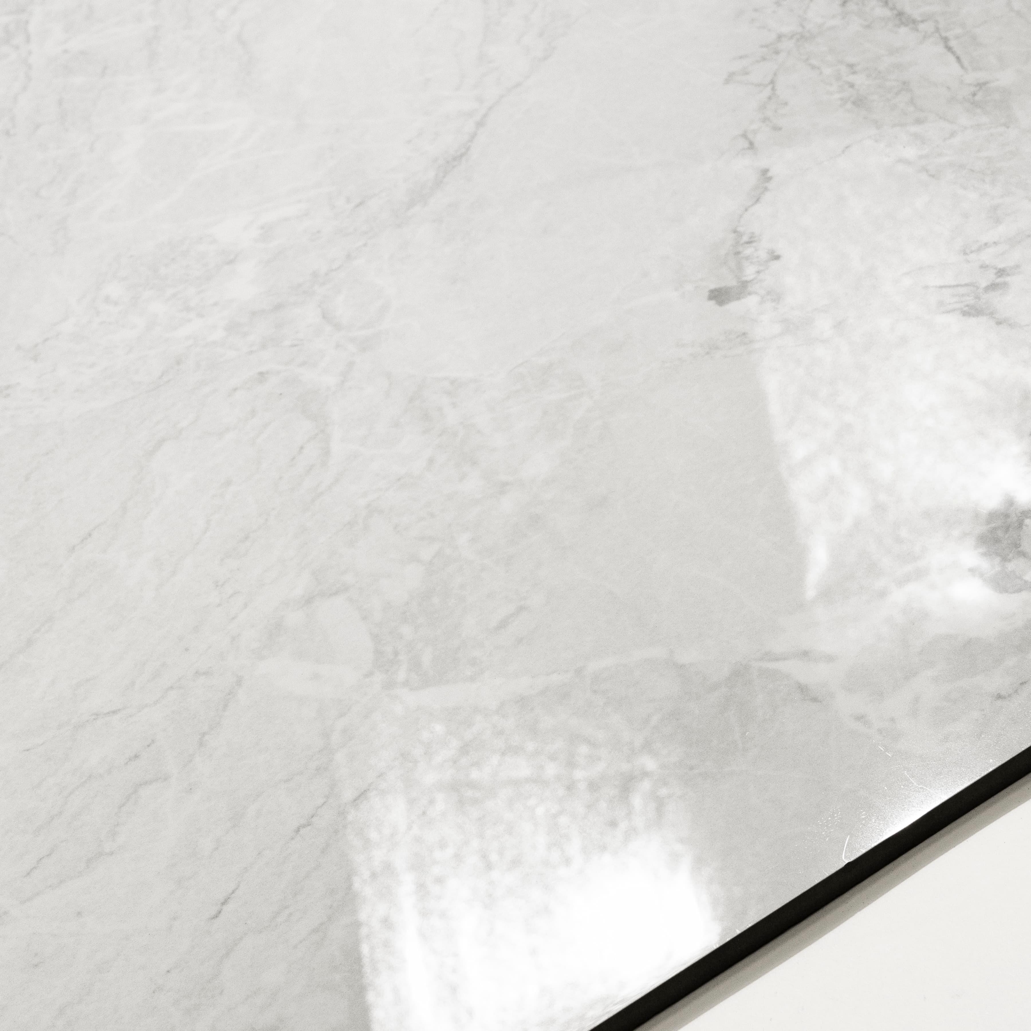 Close-up of Silver Fume glossy porcelain tile showing mirror-polished white marble surface with detailed silver vein clusters and 9mm thickness