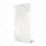 Impact_Statuario large format porcelain slab angled view highlighting polished white marble finish, dramatic linear veining, and rectified edges