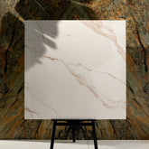 Grisial Pink 120x120cm glossy porcelain tile flat view showing soft ivory marble surface with warm copper and gold veining