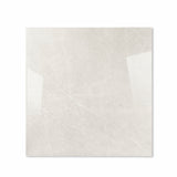 Pietra Bianco glossy porcelain tile 120x120cm displayed on easel against luxury marble backdrop for UAE interior design