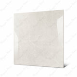 Pietra Bianco large format porcelain tile angled view highlighting polished limestone marble finish, subtle veining, and rectified edges