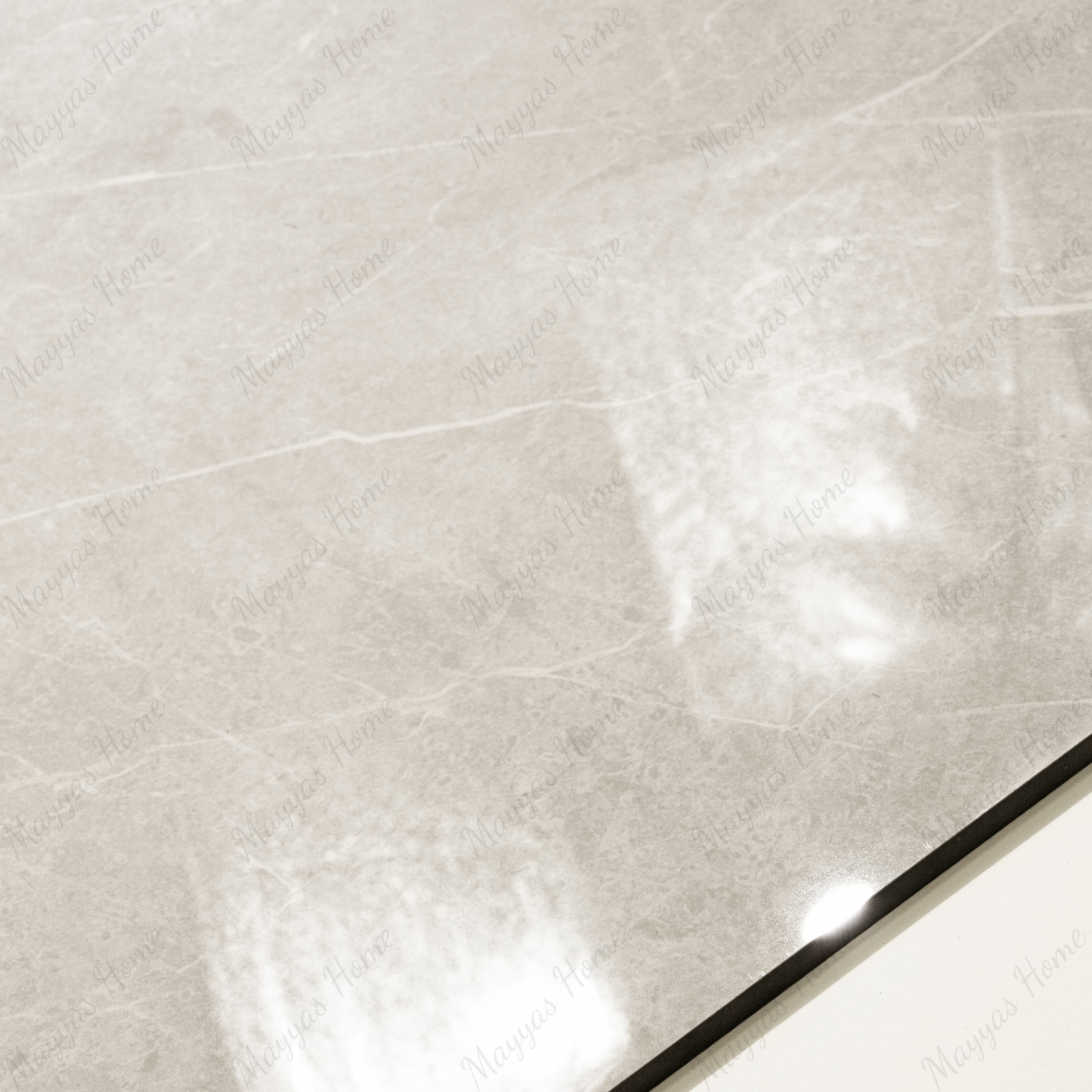 Close-up of Pietra Bianco glossy porcelain tile showing mirror-polished ivory stone surface with fine natural vein detail and 9mm thickness