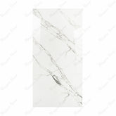 Garfagnana BM porcelain slab displayed on easel against luxury backdrop showing pure white marble surface with delicate grey diagonal veining for UAE interior design