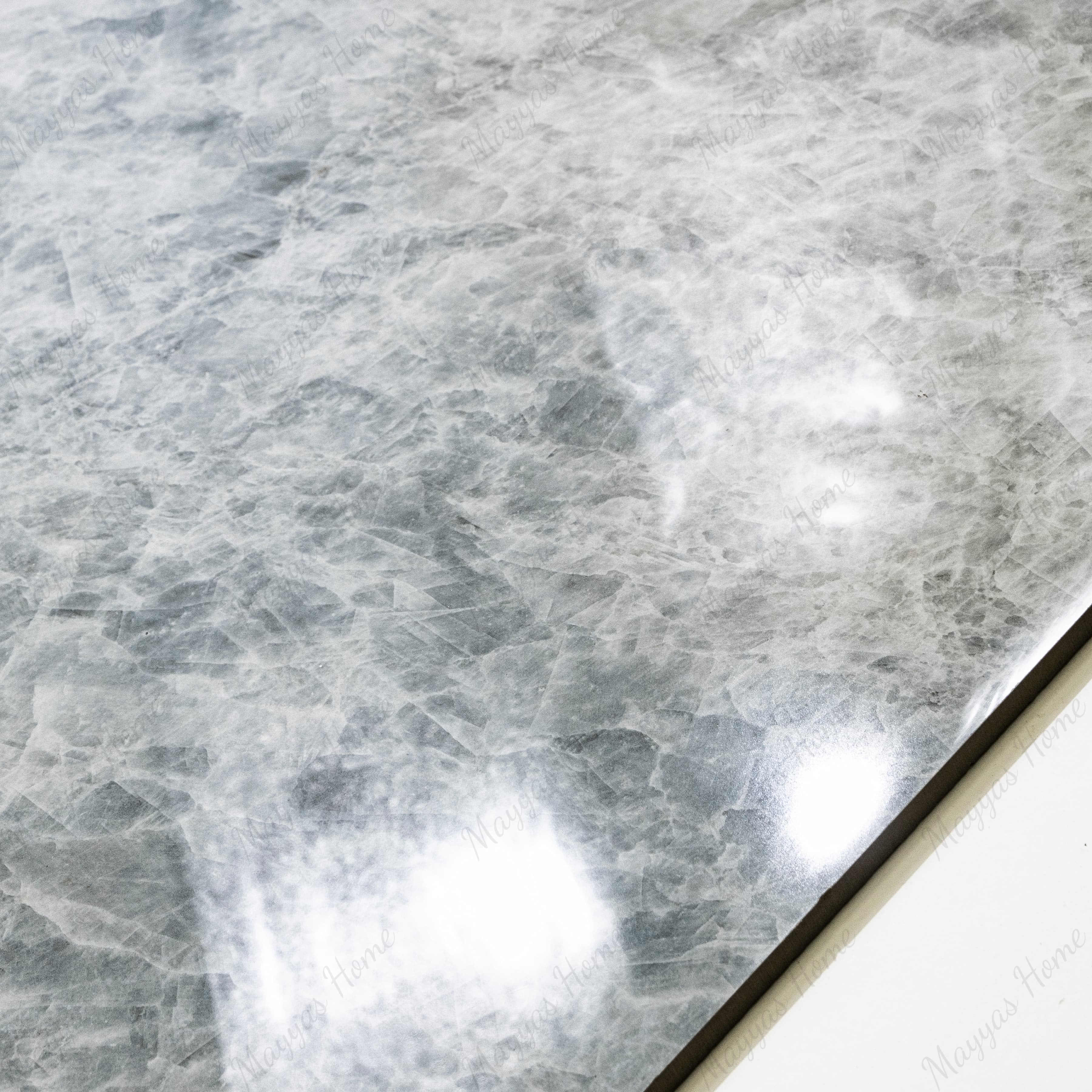 Close-up of Celest Onyx glossy porcelain tile showing mirror-polished icy grey surface with detailed crystalline texture and 9mm thickness