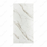 Calacatta Gold BM Matte porcelain slab displayed on easel against luxury backdrop showing white Calacatta marble with bold diagonal grey-gold veining for UAE interior design