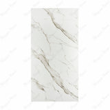 Calacatta Gold BM Matte porcelain slab displayed on easel against luxury backdrop showing white Calacatta marble with bold diagonal grey-gold veining for UAE interior design