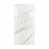 Gronza White BM porcelain slab displayed on easel against luxury backdrop showing bright white marble surface with elegant grey and gold veining for UAE interior design