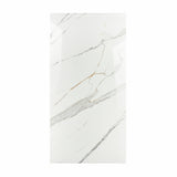 Gronza White BM porcelain slab displayed on easel against luxury backdrop showing bright white marble surface with elegant grey and gold veining for UAE interior design