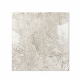 Breccia Bianco glossy porcelain tile 120x120cm displayed on easel against luxury marble backdrop for UAE interior design