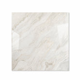 Antaliya White glossy porcelain tile 120x120cm displayed on easel against luxury marble backdrop for UAE interior design