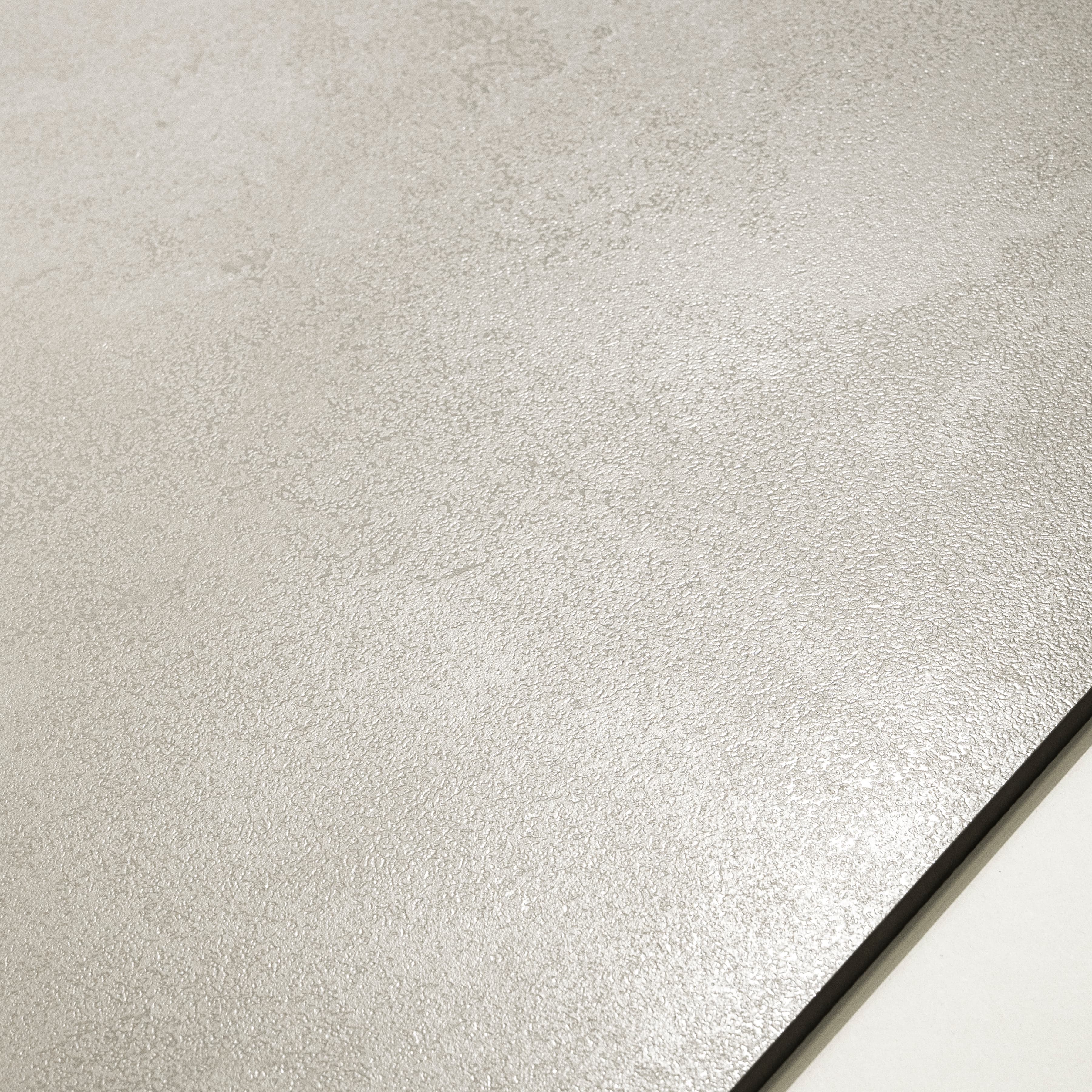 Meera Grey matte porcelain tile 120x120cm displayed on easel against luxury marble backdrop for UAE interior design