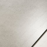 Close-up of Vera Grey matte porcelain tile showing detailed concrete-stone texture with natural speckled detail and 9mm thickness