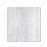 Stonex Grey matte porcelain tile 120x120cm displayed on easel against luxury marble backdrop showing terrazzo aggregate texture for UAE interiors