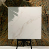 Cecelia Gold 120x120cm matt porcelain tile with soft cream base and golden veining. Elegant, durable, and ideal for modern luxury interiors.