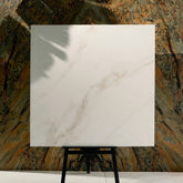 Cecelia Gold 120x120cm matt porcelain tile with soft cream base and golden veining. Elegant, durable, and ideal for modern luxury interiors.