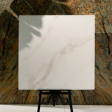 Cecelia Gold 120x120cm matt porcelain tile with soft cream base and golden veining. Elegant, durable, and ideal for modern luxury interiors.