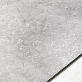 Resina Grey large format porcelain tile angled view highlighting matte stone finish, weathered marble effect, and rectified edges