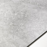 Resina Grey large format porcelain tile angled view highlighting matte stone finish, weathered marble effect, and rectified edges