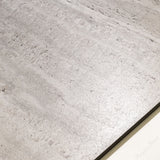 Roma Travertino Bianco large format porcelain tile angled view highlighting matte travertine finish, linear veining, and rectified edges