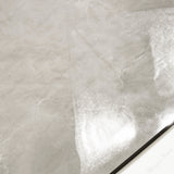 Close-up of Royal Beige glossy porcelain tile showing mirror-polished marble surface with delicate white vein detail and 9mm thickness