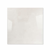 Onyx Helio glossy porcelain tile 120x120cm displayed on easel against luxury marble backdrop for UAE interior design