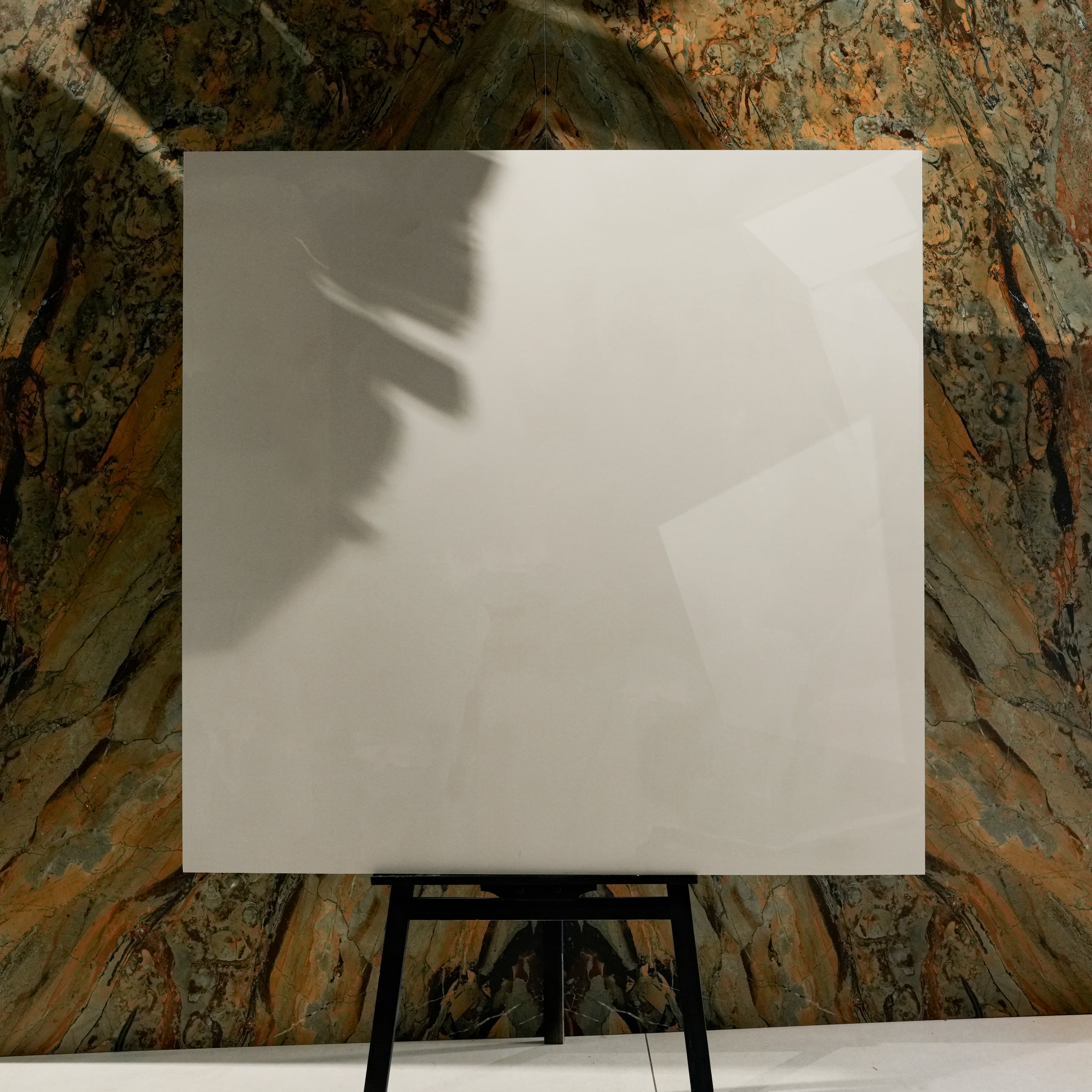 Onyx Helio 120x120cm glossy porcelain tile flat view showing translucent ivory onyx surface with soft cloudy movement