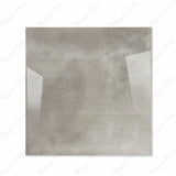 Portland Grey glossy porcelain tile 120x120cm displayed on easel against luxury marble backdrop for UAE interior design