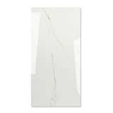 Calacatta Bianco glossy marble effect porcelain tile 60x120cm with 9mm thickness features bold veining and a refined polished finish for luxury spaces.