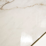 Calcutta Bianco Oro glossy marble porcelain tile 60x120cm with 9mm thickness features white base, gold and grey veining with polished finish.