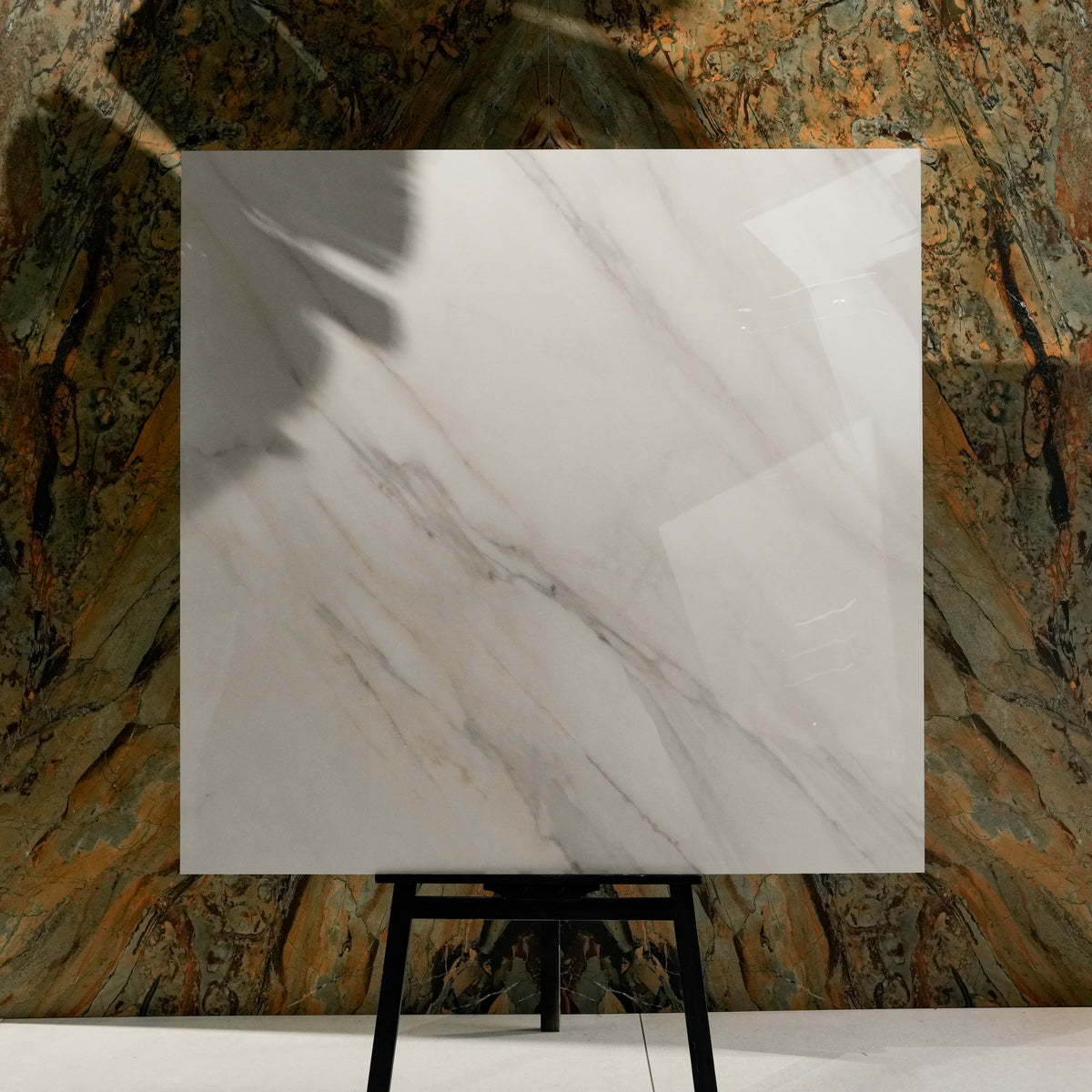 Calcutta Aurora 120x120cm glossy porcelain tile flat view showing bright white Calacatta marble surface with flowing grey veining