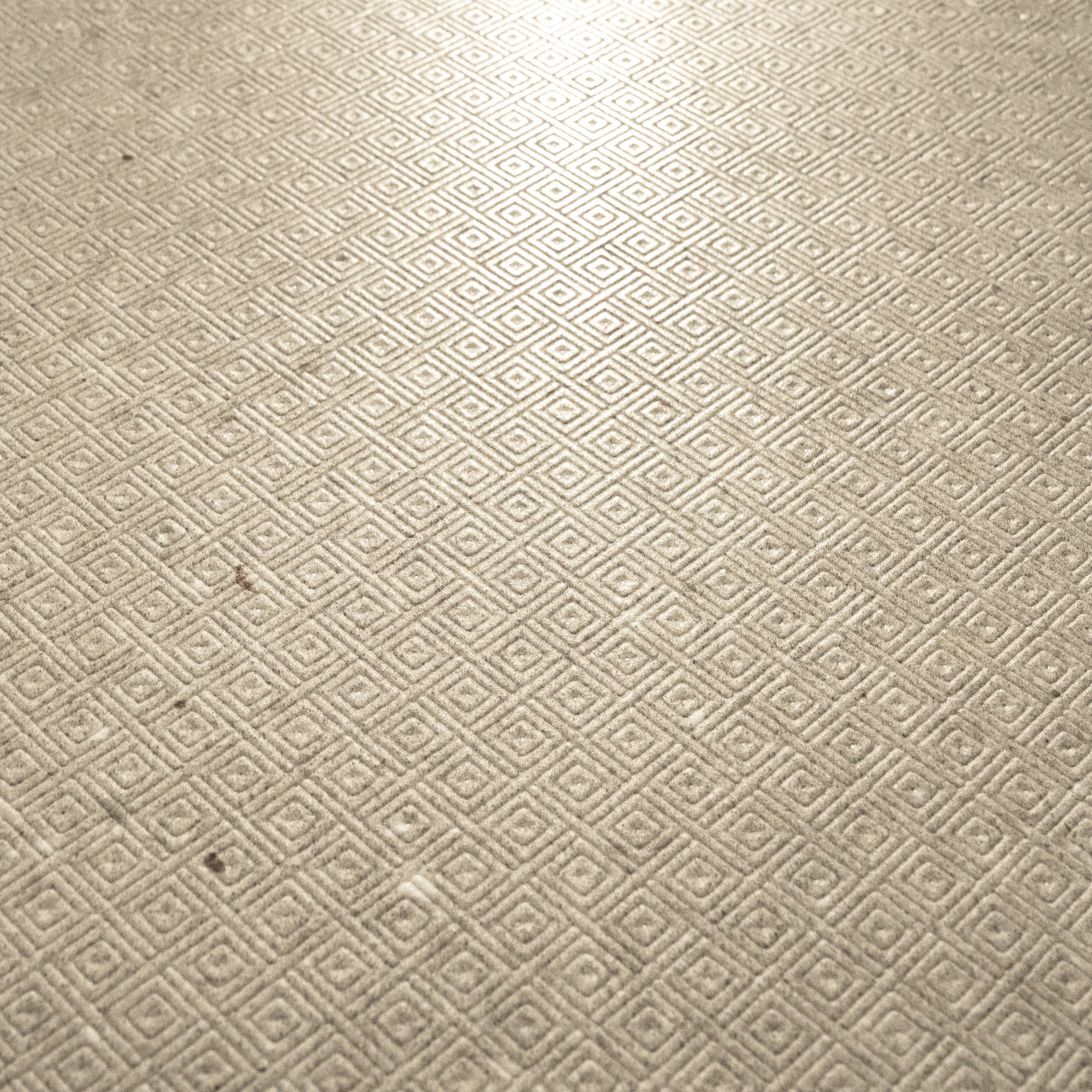 Close-up of Element Arsenica Ivory porcelain slab showing refined ivory surface with delicate mineral speckle and warm neutral undertones