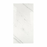 Statuario Platina BM porcelain slab displayed on easel against luxury backdrop showing crisp white marble surface with elegant grey veining for UAE interior design