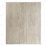 Vero White Ash wood-look porcelain plank tiles arranged in multi-plank layout showing natural oak grain pattern for UAE interior design