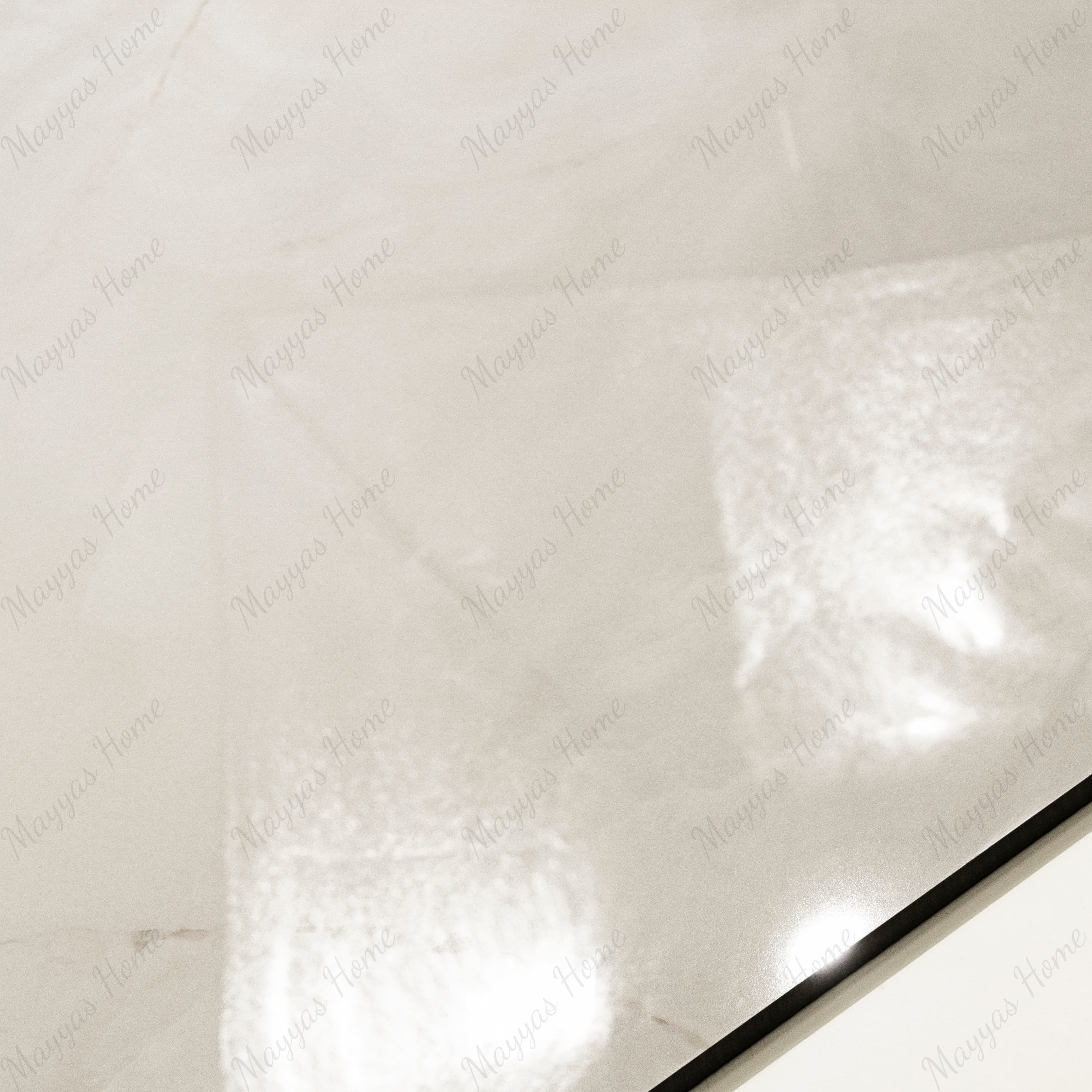Close-up of Crema Onyx glossy porcelain tile showing mirror-polished cream onyx surface, gold vein detail, and 9mm thickness