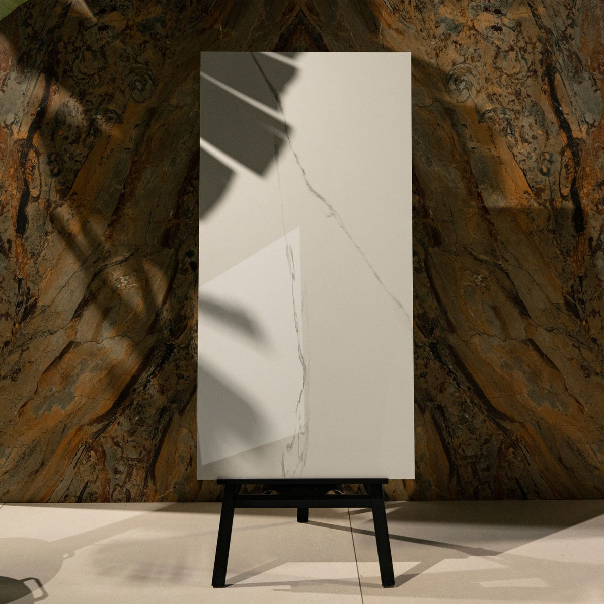 Calacatta Bianco glossy marble effect porcelain tile 60x120cm with 9mm thickness features bold veining and a refined polished finish for luxury spaces.