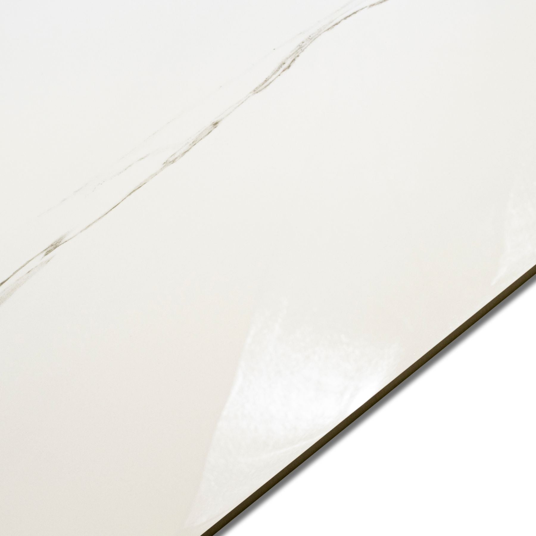 Calacatta Bianco glossy marble effect porcelain tile 60x120cm with 9mm thickness features bold veining and a refined polished finish for luxury spaces.