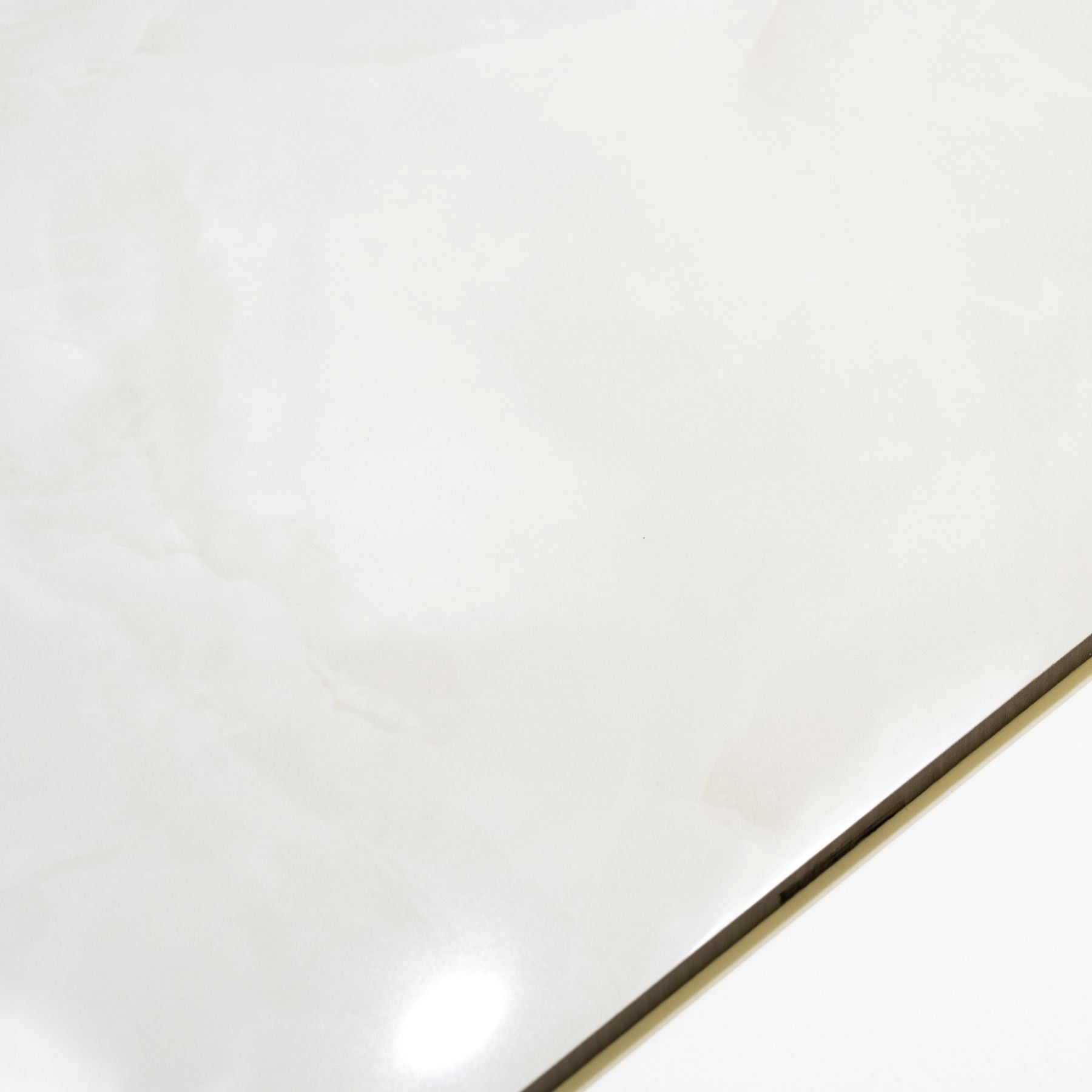 Crema White glossy marble effect porcelain tile 60x120cm with 9mm thickness features soft cream tones, subtle veining and elegant polished finish.