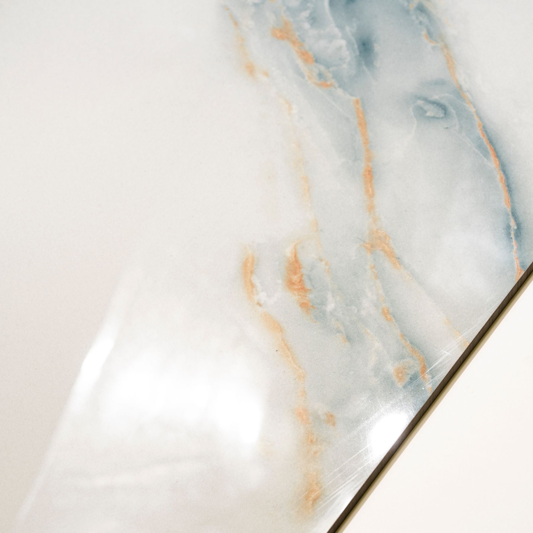 Grazzu Azul glossy marble effect porcelain tile 60x120cm with 9mm thickness features rich blue tones and polished luxury finish.