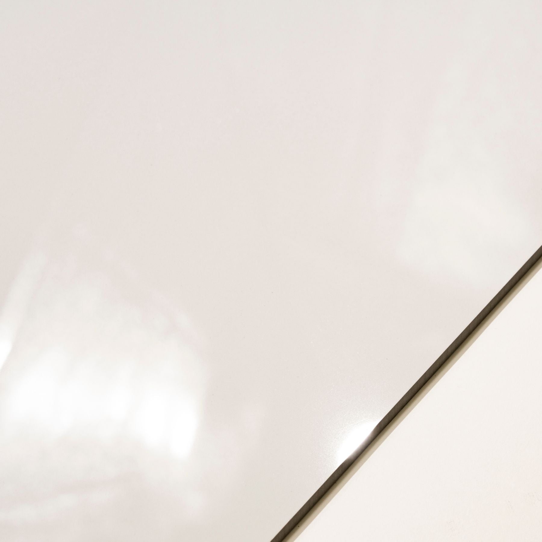 Plain White glossy porcelain tile 60x120cm with 9mm thickness features clean white surface and polished finish for modern interiors.