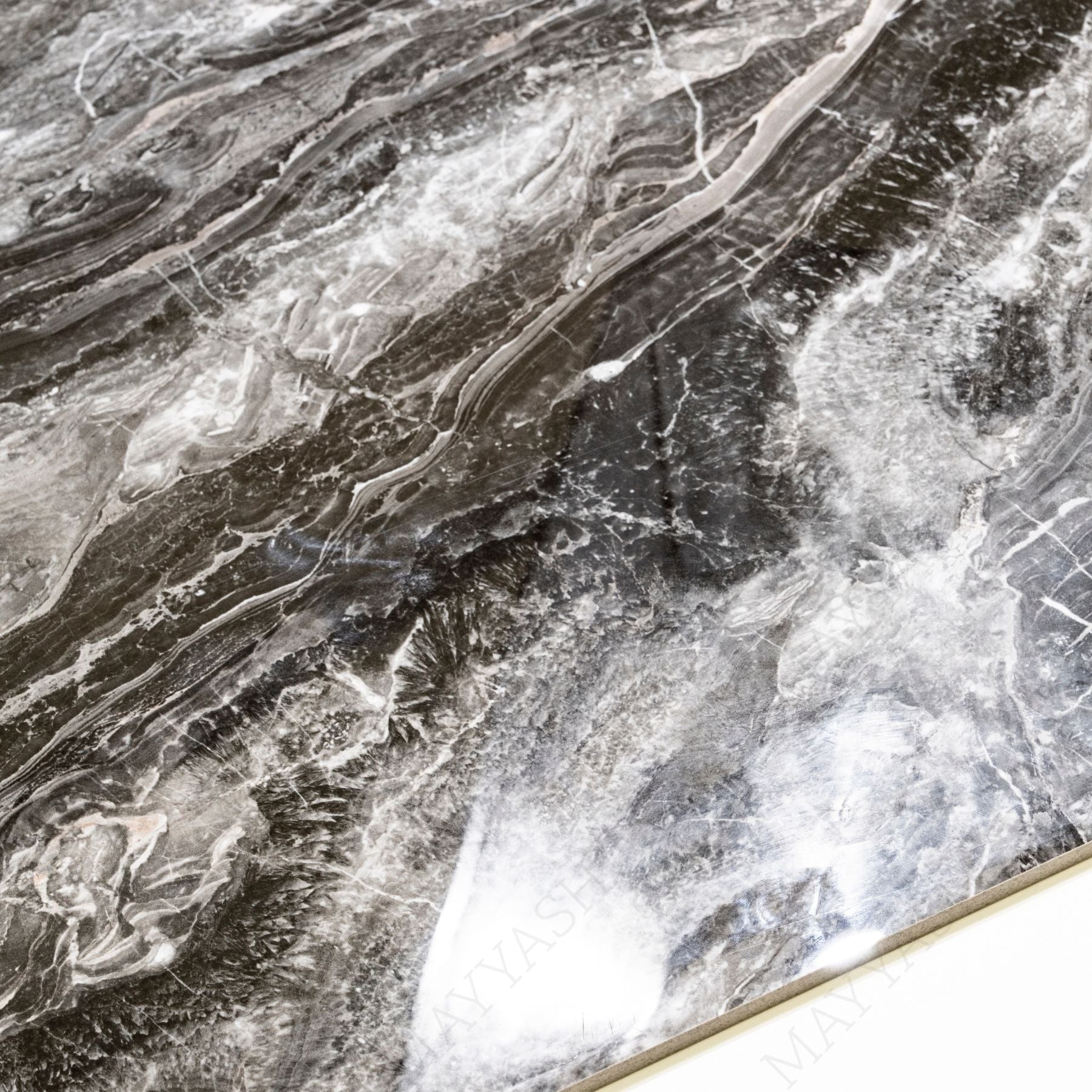 Royal Obsidian glossy porcelain tile 60x120cm with 9mm thickness features deep black tones, bold natural veining and elegant polished surface finish.