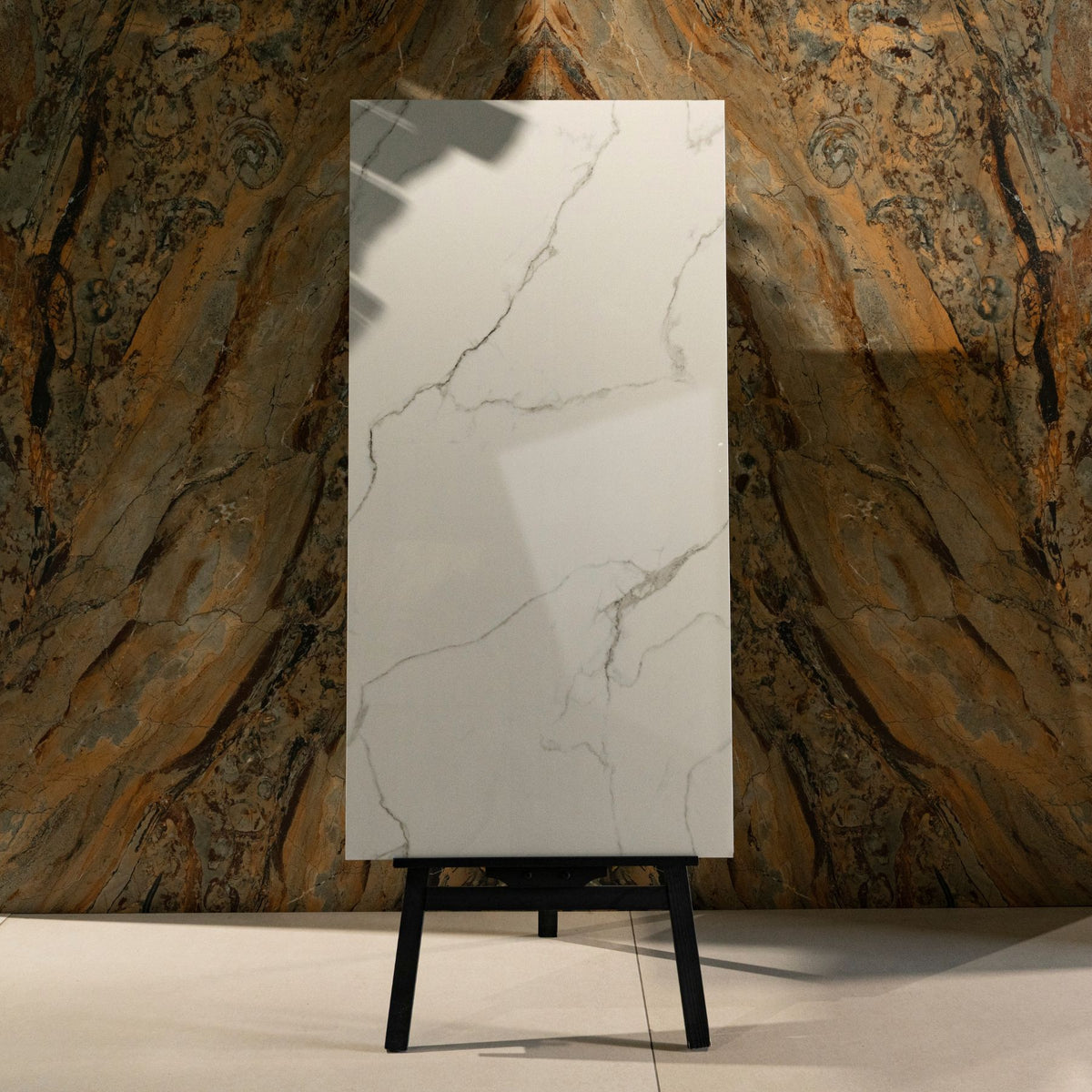 Statuario Ocean glossy marble effect porcelain tile 60x120cm with 9mm thickness features white base, soft grey veining, subtle ocean tones and polished finish.